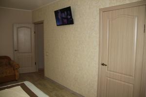 a room with a door and a picture on the wall at Современная 1-комнатная квартира in Kharkiv