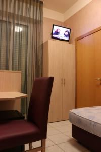 TV a/nebo společenská místnost v ubytování Hotel Levante