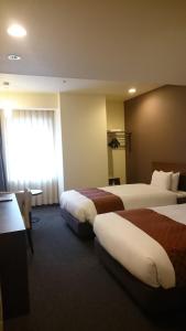 Postel nebo postele na pokoji v ubytování Hotel Ascent Plaza Hamamatsu + 30 fotografií