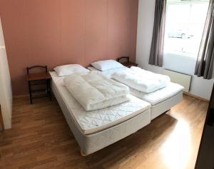 Postel nebo postele na pokoji v ubytování Kaikanten Gryllefjord