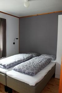 Säng eller sängar i ett rum på Kaikanten Gryllefjord