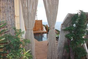 a view from the balcony of a resort with a pool at Mandalina Suites in Kaş