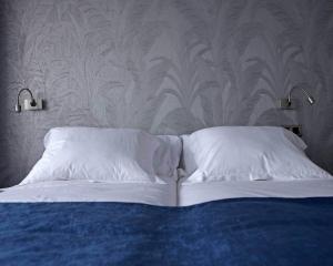 Postel nebo postele na pokoji v ubytování Hostal Averroes