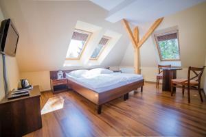 En eller flere senge i et værelse på Pokoje Gościnne Pod Sosnami