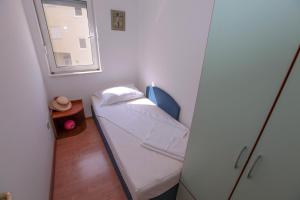 Ένα ή περισσότερα κρεβάτια σε δωμάτιο στο Apartments Mija