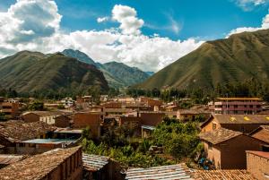 a view of a town with mountains in the background at B&B Valcava in Urubamba