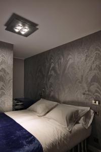 Postel nebo postele na pokoji v ubytování Hostal Averroes