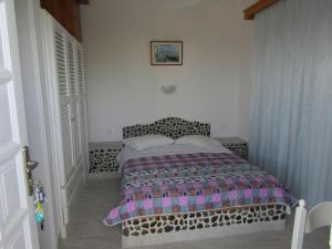 Letto o letti in una camera di Hotel Perissa