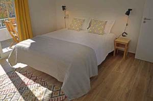 Postel nebo postele na pokoji v ubytování Alojamento Charme