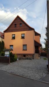 a large house with a brown roof at Ferienwohnung Dresden Nickern in Dresden