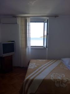 Postel nebo postele na pokoji v ubytování Studio Apartment Tomislava