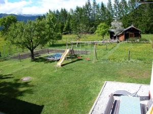 a yard with a playground with a play equipment at Appartement Huebgut in Bruck an der Großglocknerstraße