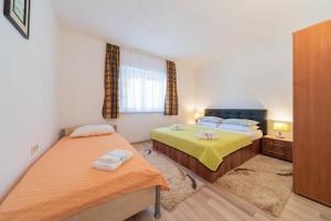Posteľ alebo postele v izbe v ubytovaní Apartmenthaus Hana