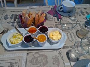 a tray of food on a table with a plate of food at La Voureyline in Saint-Antoine