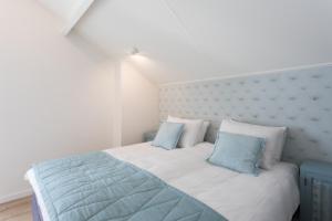 Ένα ή περισσότερα κρεβάτια σε δωμάτιο στο Villa Zeezout I Kloeg Collection