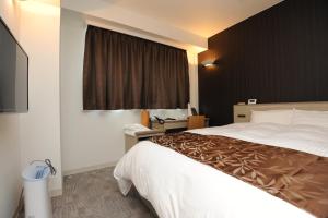 Cama ou camas em um quarto em Hotel Sunriver Shimanto