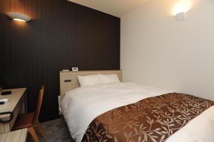 Cama ou camas em um quarto em Hotel Sunriver Shimanto