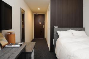 Cama ou camas em um quarto em Hotel Sunriver Shimanto