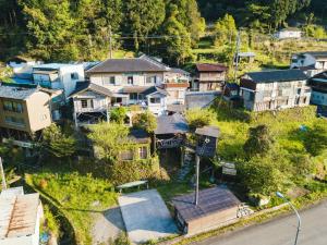 an aerial view of a small village with houses at Momonga Village in Miyoshi