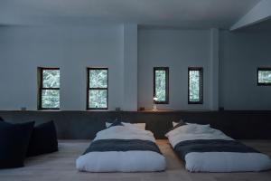 Кровать или кровати в номере yl & Co. Hotel in Mt.Fuji