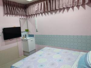 Letto o letti in una camera di 永春棧Kozzy Apartment
