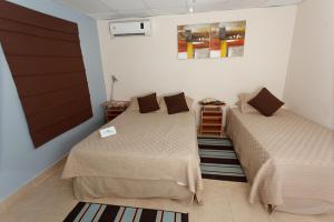 Ένα ή περισσότερα κρεβάτια σε δωμάτιο στο Hostal Gemar
