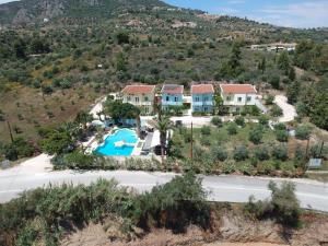 an aerial view of a resort with a swimming pool at Meraki Apartments and Studios in Tolo