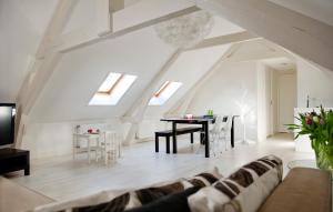 a living room with a couch and a table at Bed en Brood - Veere in Veere