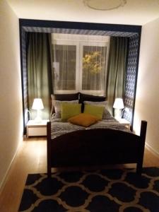 Łóżko lub łóżka w pokoju w obiekcie Apartament Pruszków