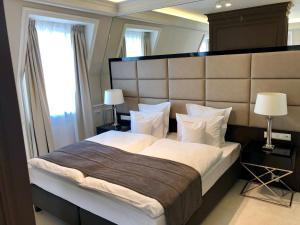 מיטה או מיטות בחדר ב-Hotel Mansor