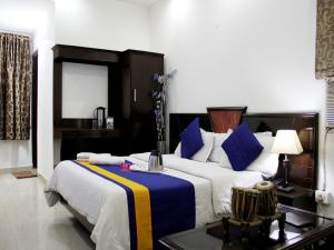 Postel nebo postele na pokoji v ubytování Hotel Sun International