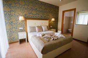Postel nebo postele na pokoji v ubytování Hotel Lady Mary