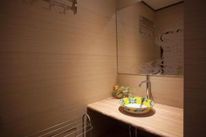 a bathroom with a sink and a bowl on a counter at Oyama TABI-NE in Kanazawa