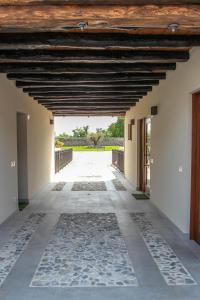 an empty hallway of a house with a wooden ceiling at Al Sa di Te in Udine