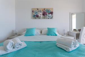 a bedroom with a bed with towels on it at Apartment Jakov i Lucija in Dubrovnik