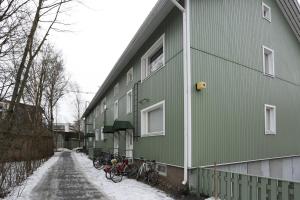 a group of bikes parked on the side of a building at Cozy studio near University of Turku in Turku