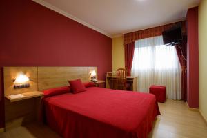 Postel nebo postele na pokoji v ubytování Hotel Restaurante Pontiñas