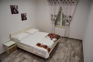 Łóżko lub łóżka w pokoju w obiekcie Villa Rubesco