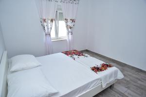 Łóżko lub łóżka w pokoju w obiekcie Villa Rubesco