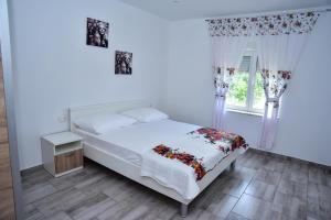 Łóżko lub łóżka w pokoju w obiekcie Villa Rubesco