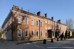 a large red brick building with white windows at Blackwell Grange Hotel in Darlington