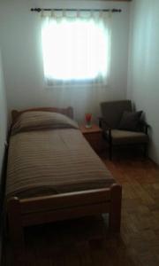 Postel nebo postele na pokoji v ubytování Apartment Tijano