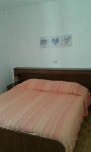 Postel nebo postele na pokoji v ubytování Apartment Tijano