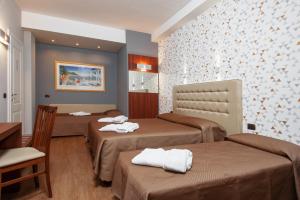 Ένα ή περισσότερα κρεβάτια σε δωμάτιο στο Bed & Breakfast Armonie Romane