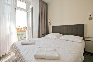 Posteľ alebo postele v izbe v ubytovaní R&B APARTMENTS POZNAŃ