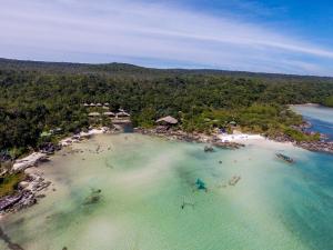an aerial view of a beach with people in the water at Mad Monkey Koh Rong Samloem in Koh Rong Sanloem