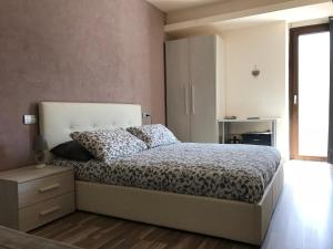 A bed or beds in a room at Cuorematto
