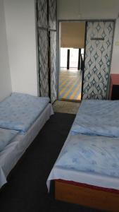 A bed or beds in a room at Hostel Strahov