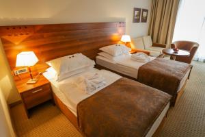 Postel nebo postele na pokoji v ubytování Hotel Trakošćan