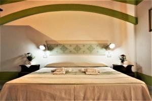 Postel nebo postele na pokoji v ubytování Country House S'Ozzastru + 37 fotografií
